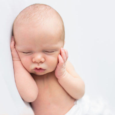 Newborn baby photography photo shoot. Sleeping baby. Photographer of photo shoot is Cheryl Catton , Woking.