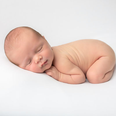 Newborn baby photography photo shoot. Sleeping baby. Photographer of photo shoot is Cheryl Catton , Woking.