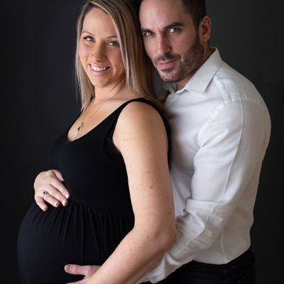 Maternity photoshoot. Mum-to-be and husband. New parents / Parents-to-be. Photographer Cheryl Catton at home studio in Woking