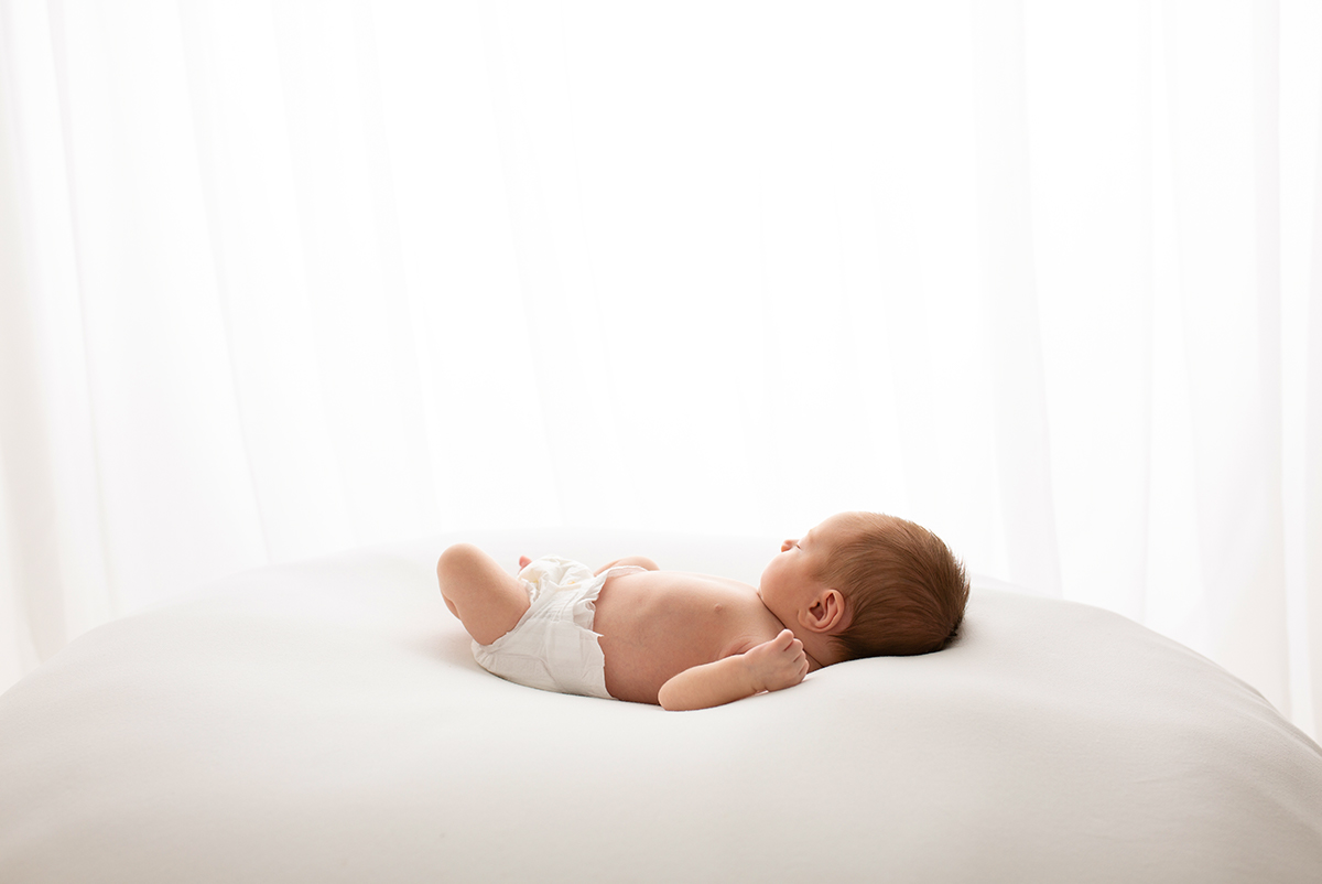 Baby girl sleeping during newborn photoshoot in Surrey
