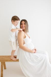 Surrey mum and son during pregnancy maternity photoshoot in a photography studio in Woking